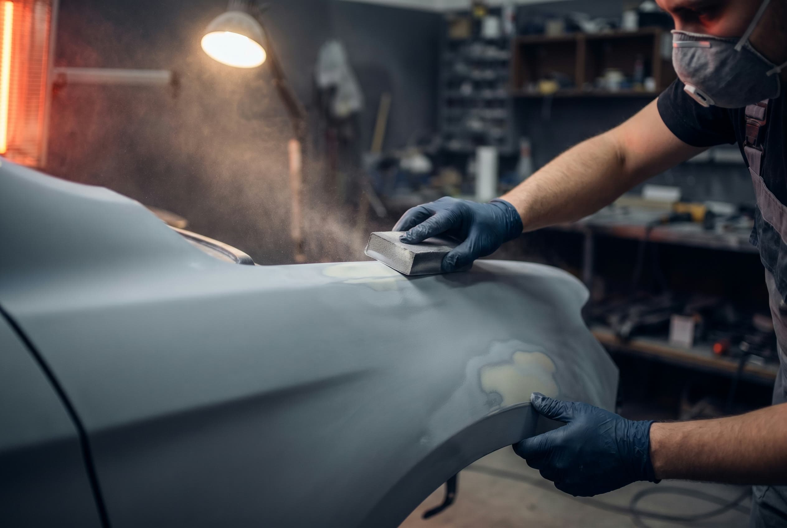 Prep — Filling, sanding and priming until the surface is dead flat.